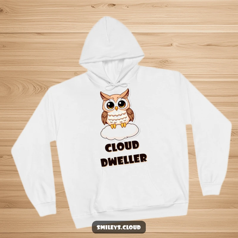 Funny owl hoodie showing a wide-eyed, curious owl resting on a cloud, designed for ultimate comfort and a touch of whimsical humor.