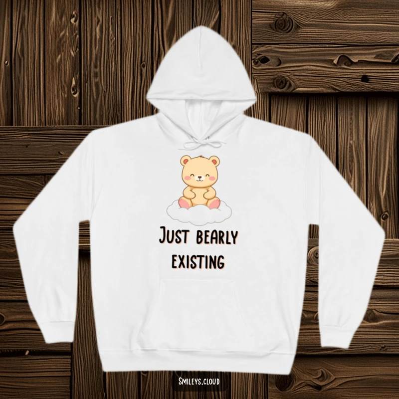 Funny hoodie showing a happy bear meditating serenely on a soft cloud, offering comfort and a dose of humor.