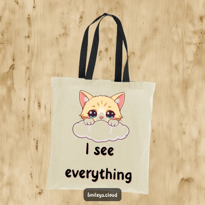 Funny tote bag showcasing a curious cat peeking over a cloud, eyes wide with fascination and a hint of playful surprise.